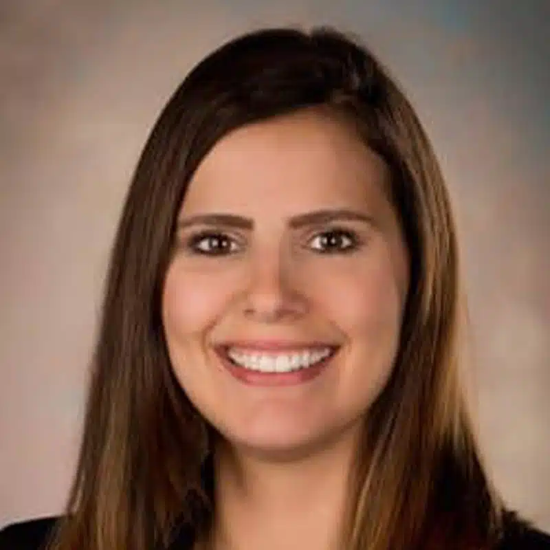 a woman smiling for the camera